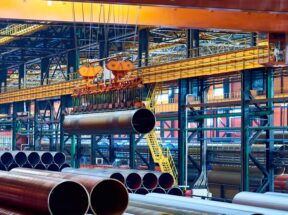 Modern crane moving steel pipe